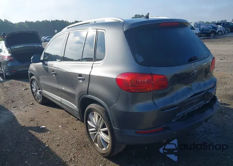2014 Volkswagen Tiguan Sel z USA, uszkodzony, nr VIN WVGAV3AXXEW556304